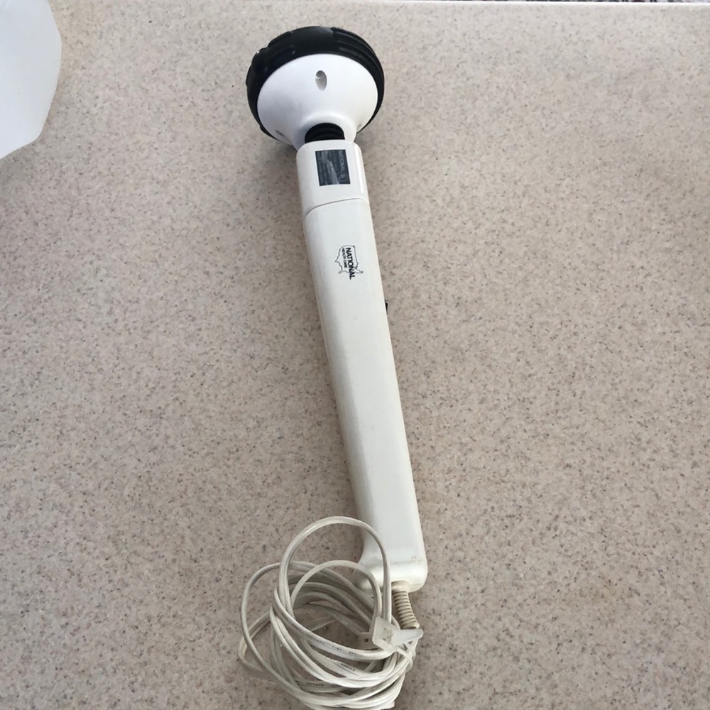 Hand held massager with heat